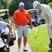 Chris Schauer, of Pinckney, watches as Ken Magee bounces a golf ball on a flaming club during the The Judy Fike Annual Golf Outing ?Tee it Up to Make a Difference for Ann Arbor Meals on Wheels!? on Monday morning. Melanie Maxwell I AnnArbor.com